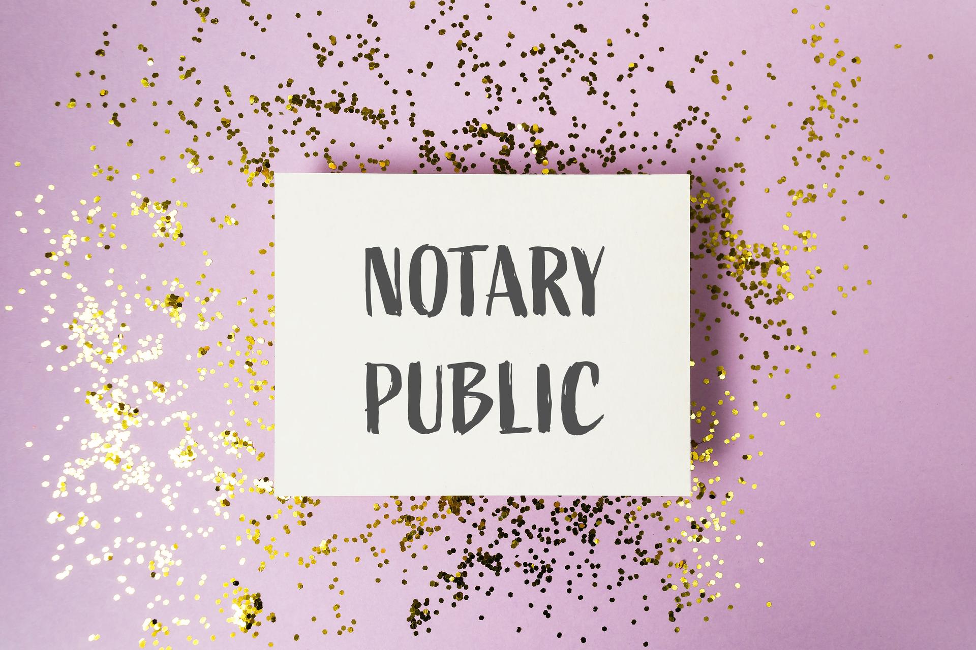 Notary public text on purple background with golden glitter accents