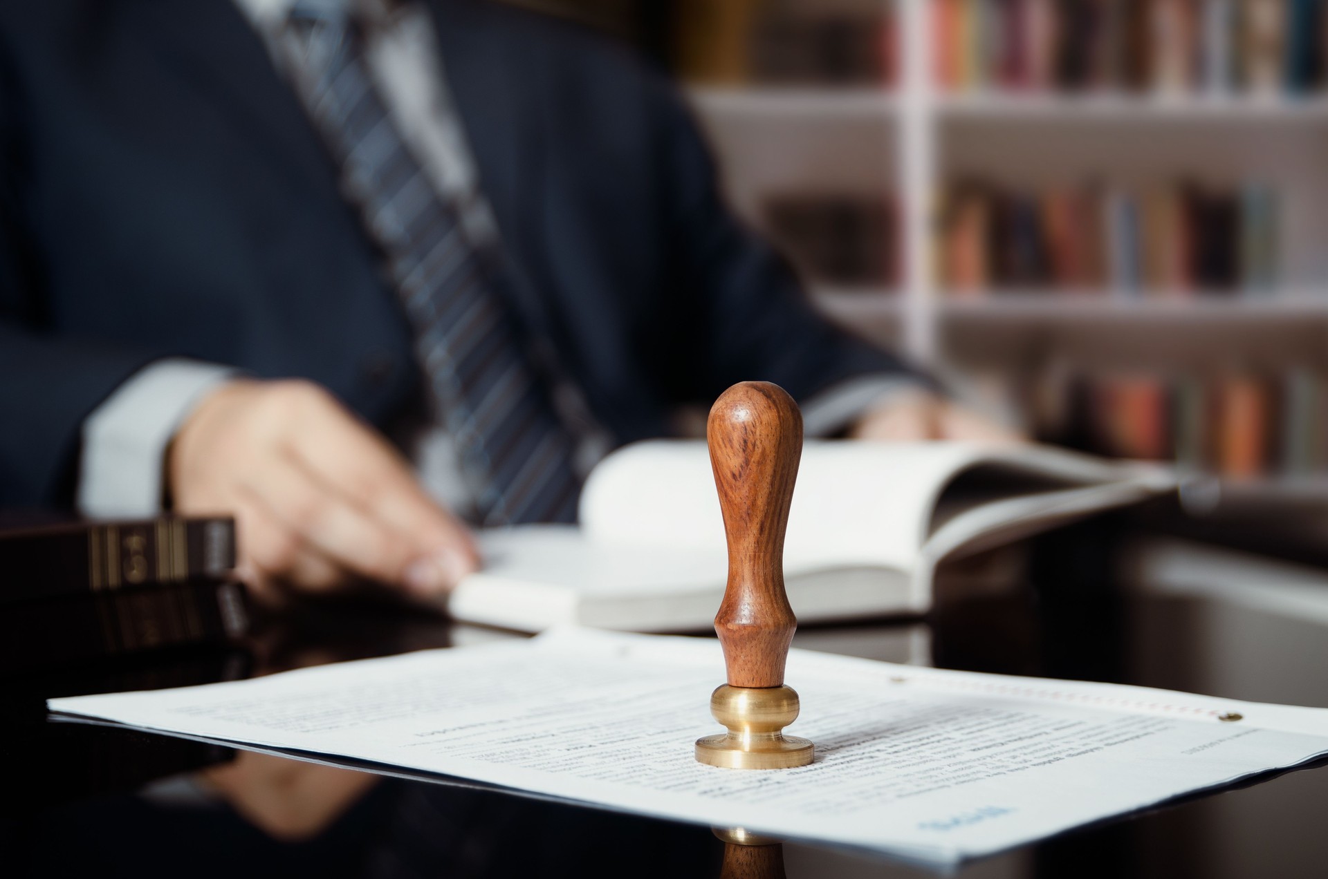 Businessman writing testament at notary public office